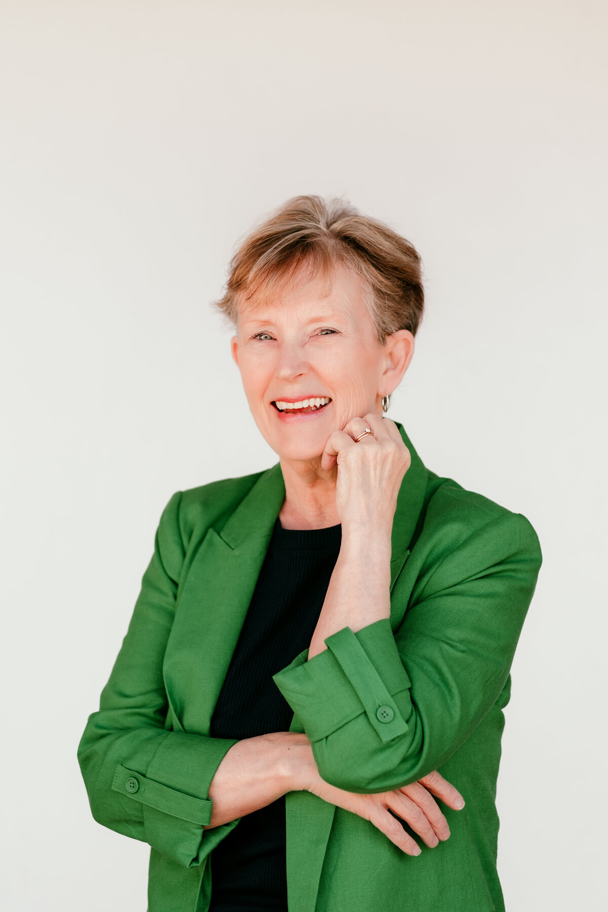 Natural light headshot for a Minneapolis consultant with approachable styling and soft focus.