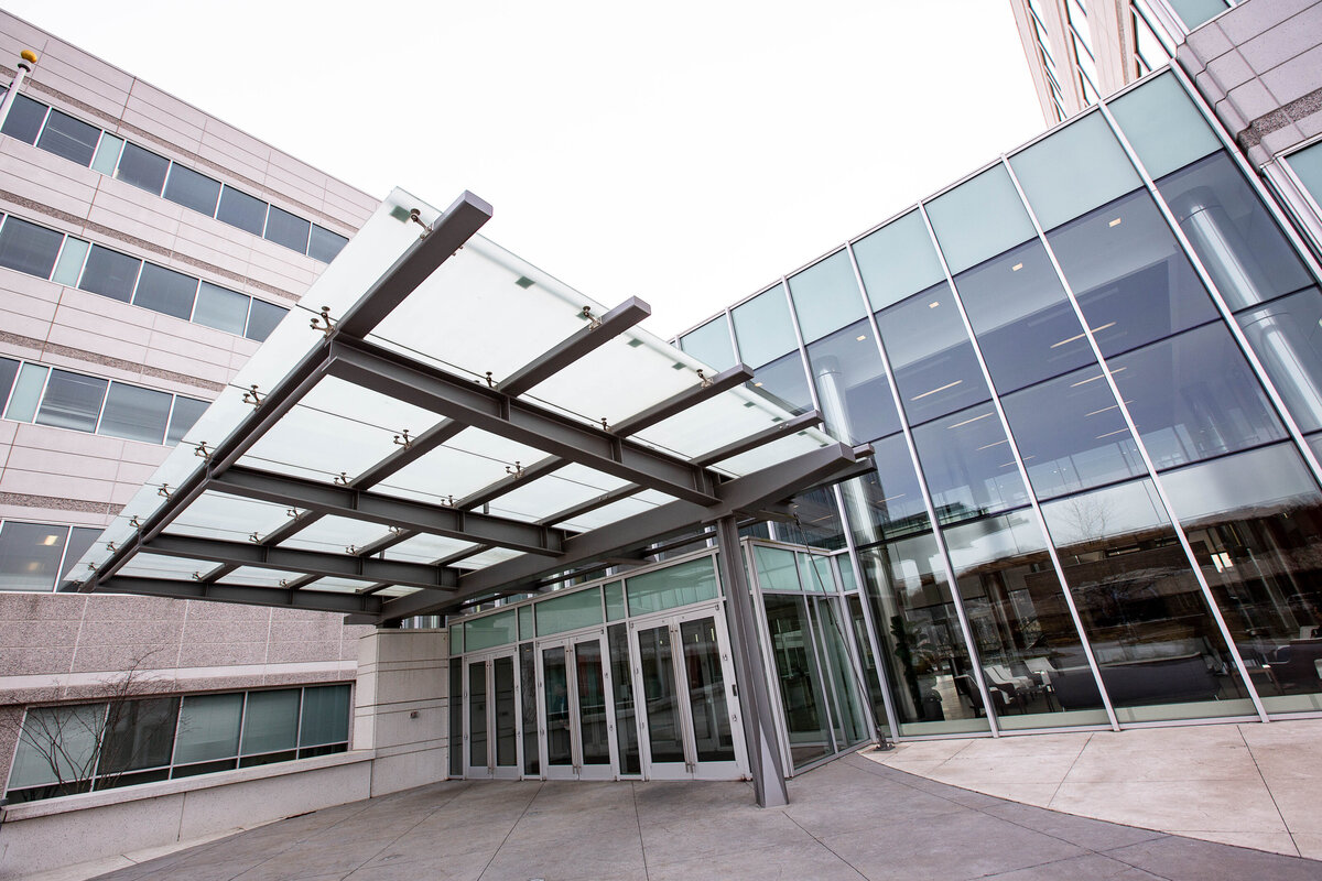Glass awning on modern building facade
