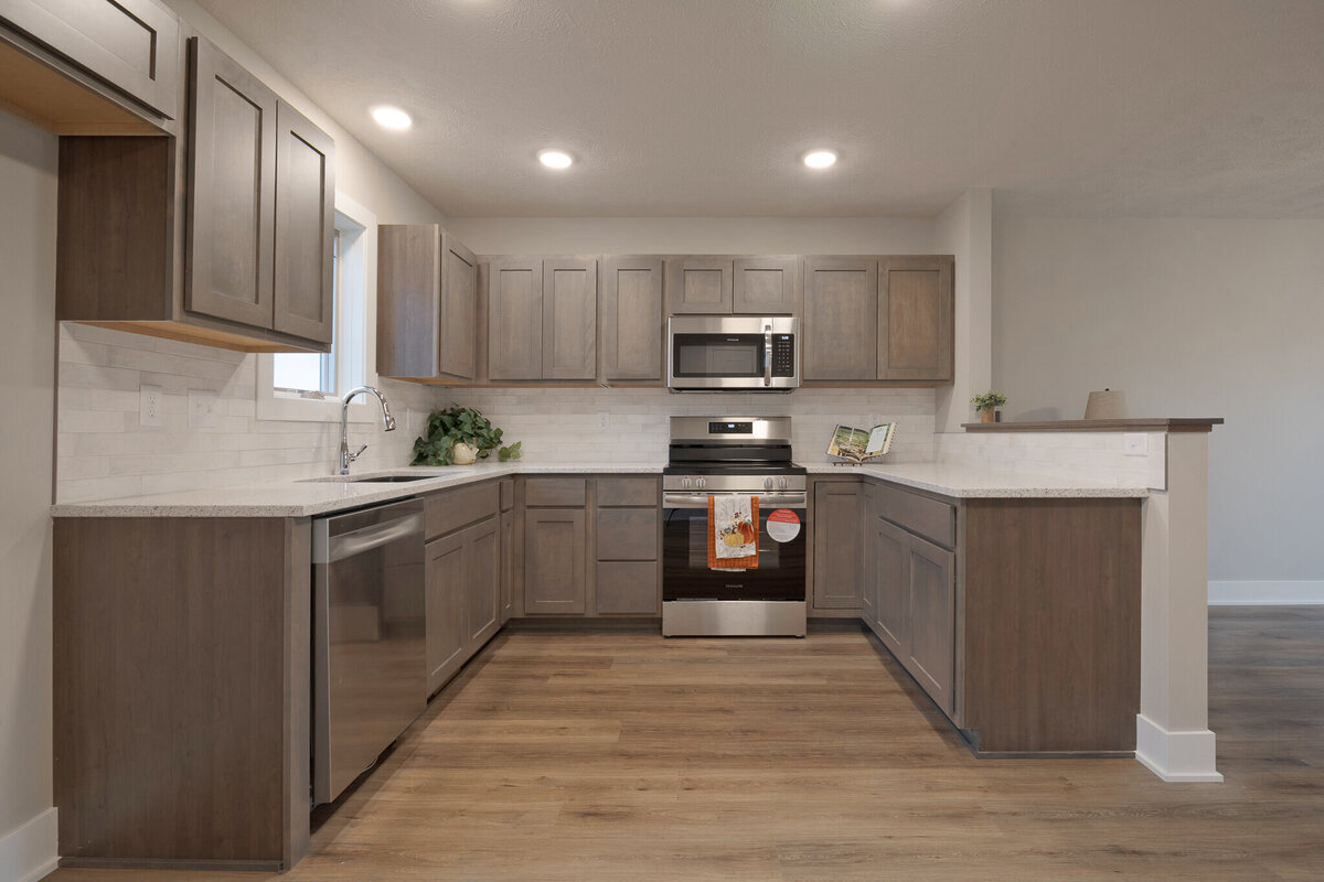 The kitchen of a beautiful new construction home for sale in Lincoln NE 7610 N 50th St built by Hartland Homes