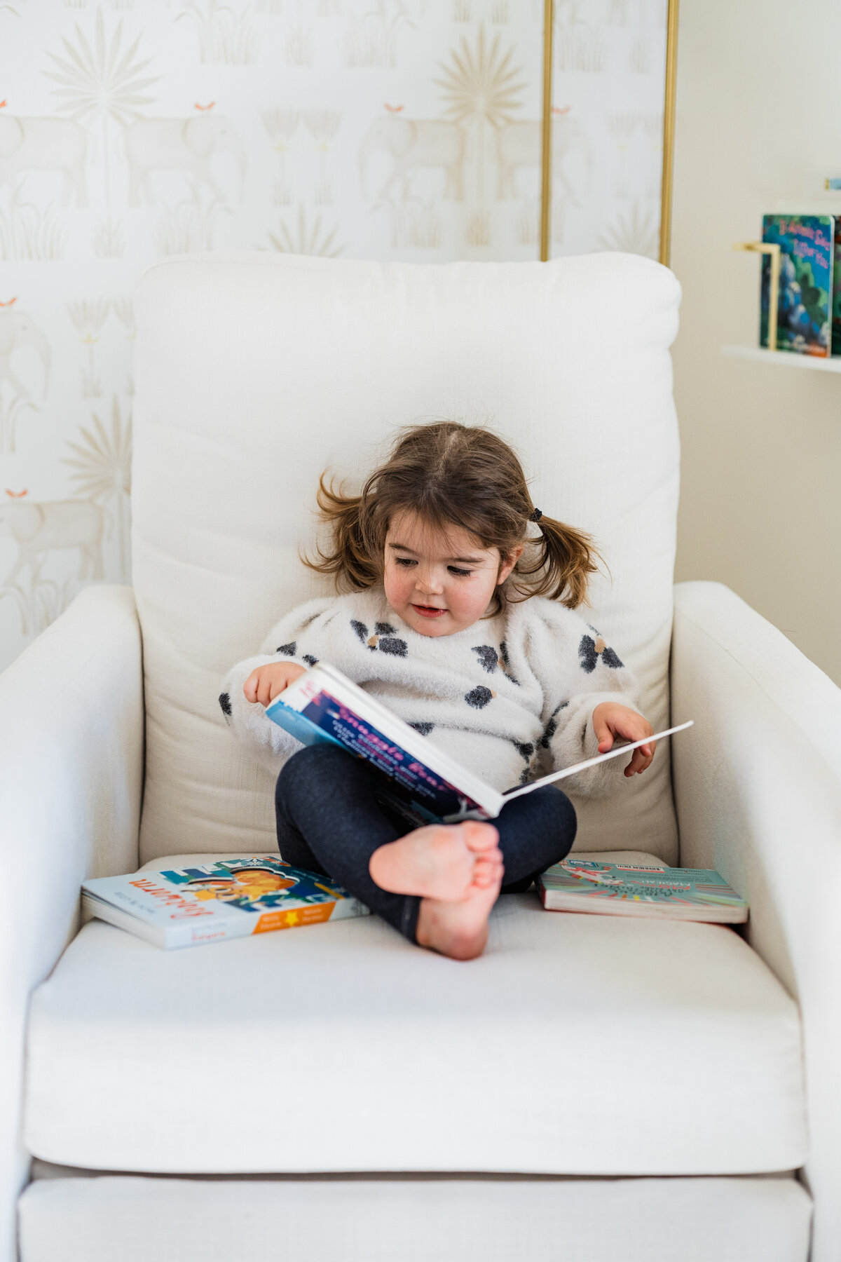 toddler-girl-reading-a-book