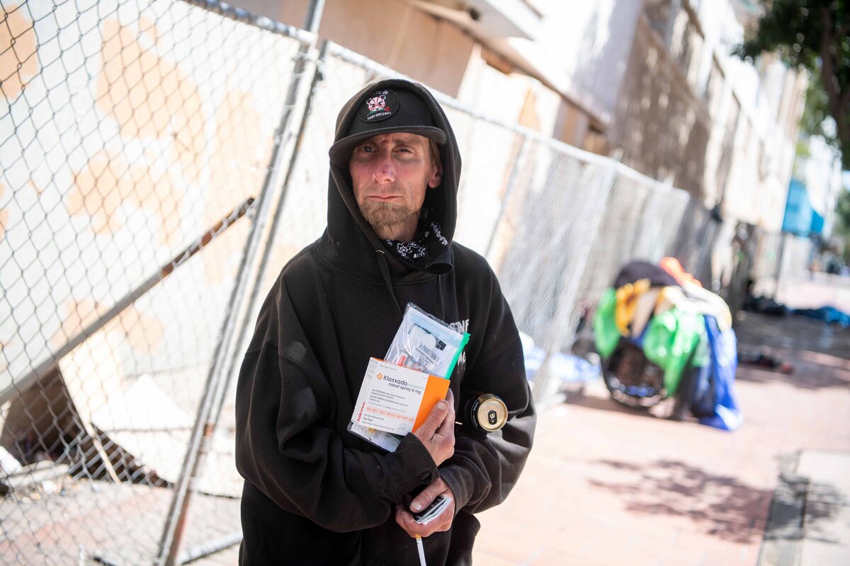 A man holds overdose medication on street in San Diego