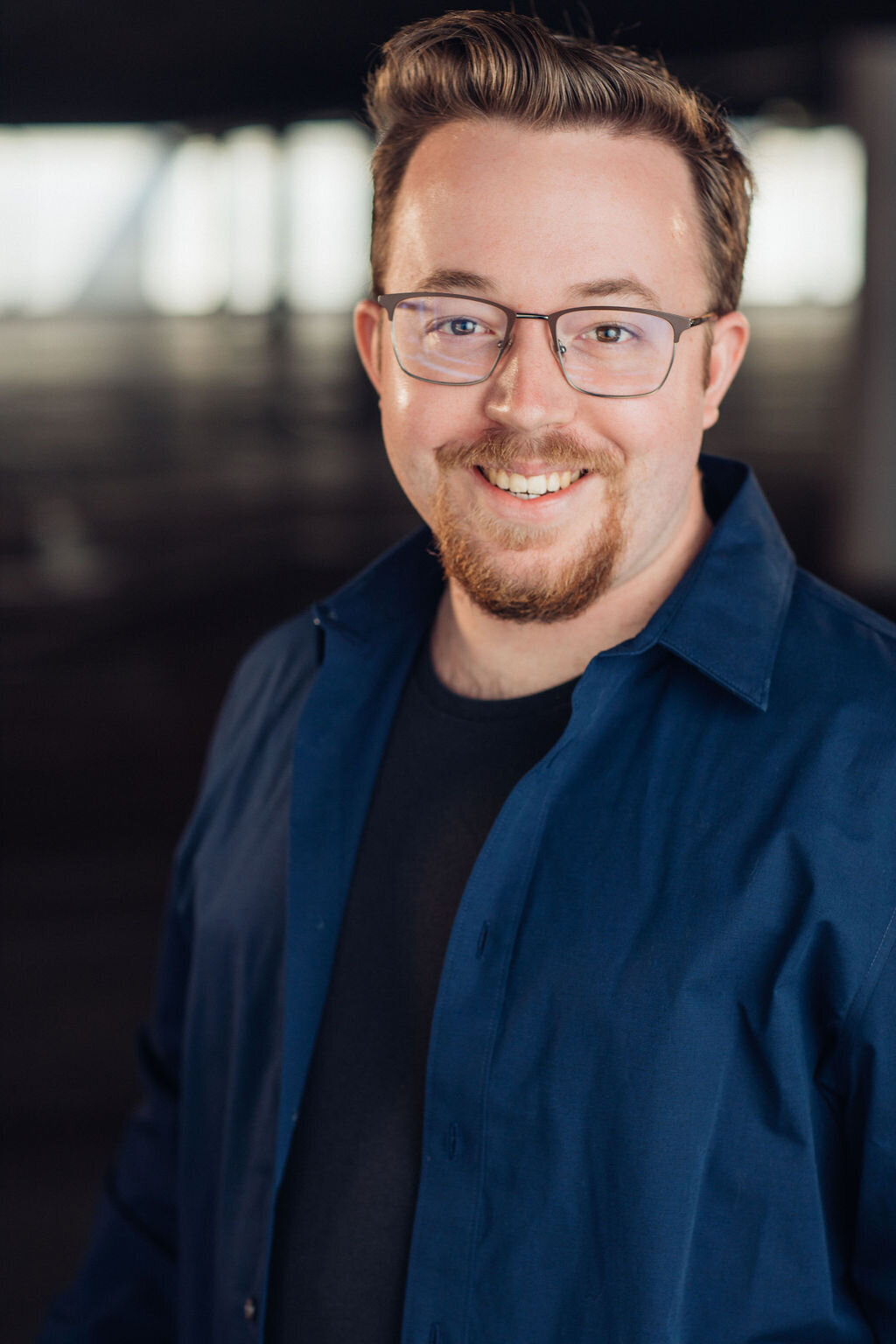 Man Wearing Navy Blue Button Down Long Sleeve and Black Inner Shirt with Eyeglasses Headshot in LA