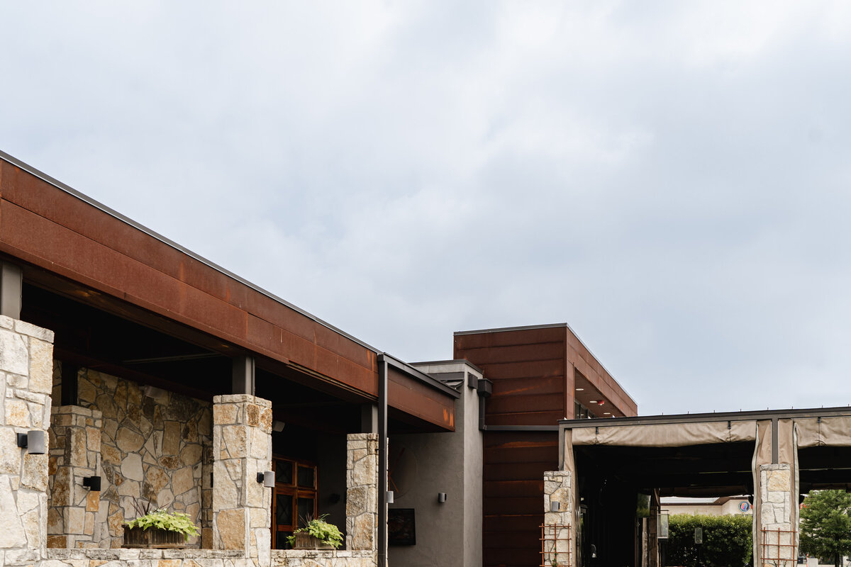 exterior walkway next to restaurant building entrance