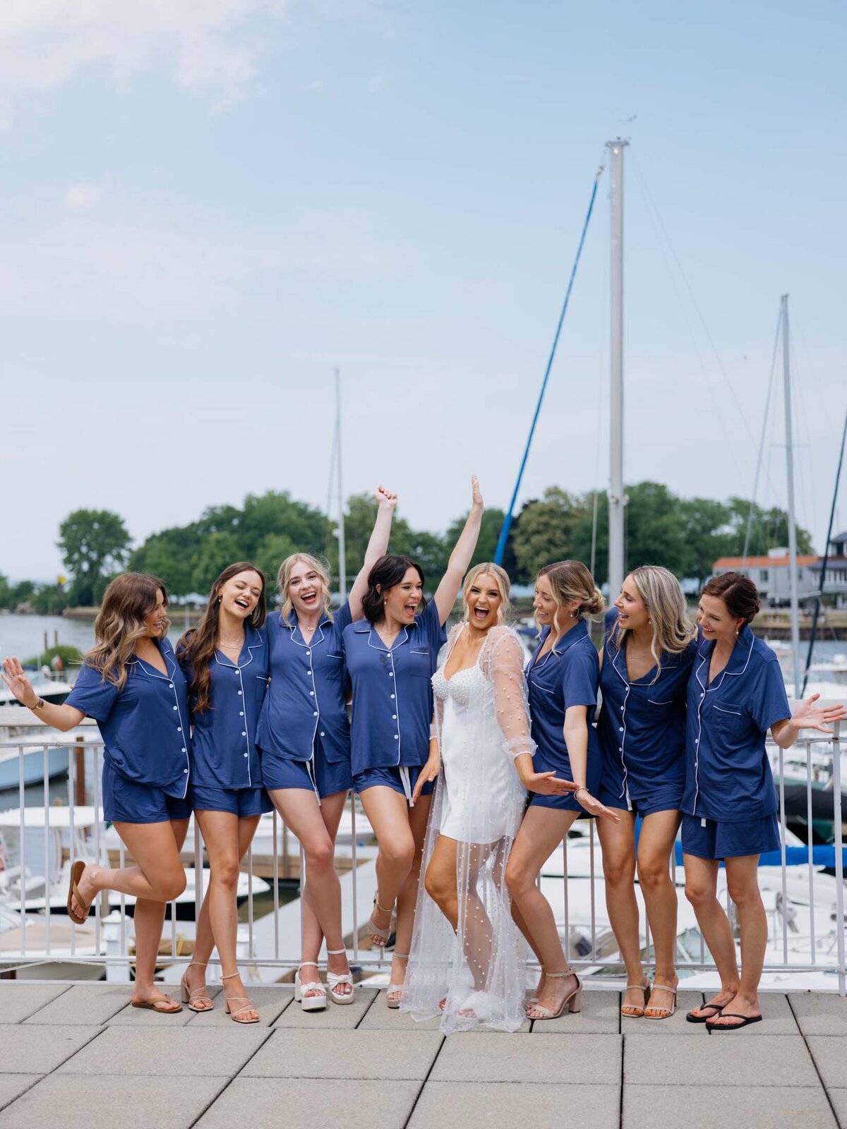 Bride with bridesmaids in matching blue pj's at Cleveland Yachting Club