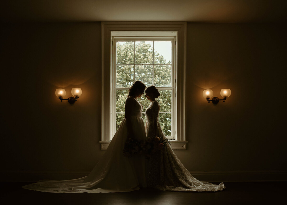 brides share an intimate moment befor the ceremony begins at President lincoln's cottage in Washington D.C.