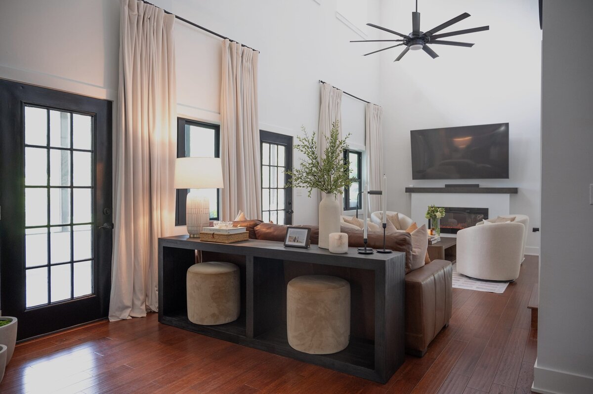 dewine design orlando interior design farmhouse modern living room with tall window curtains and neutral colors