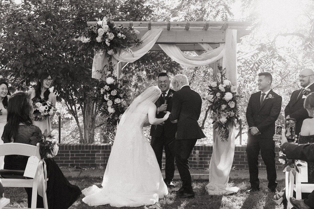 Bride and groom laughing in the wedding ceremony