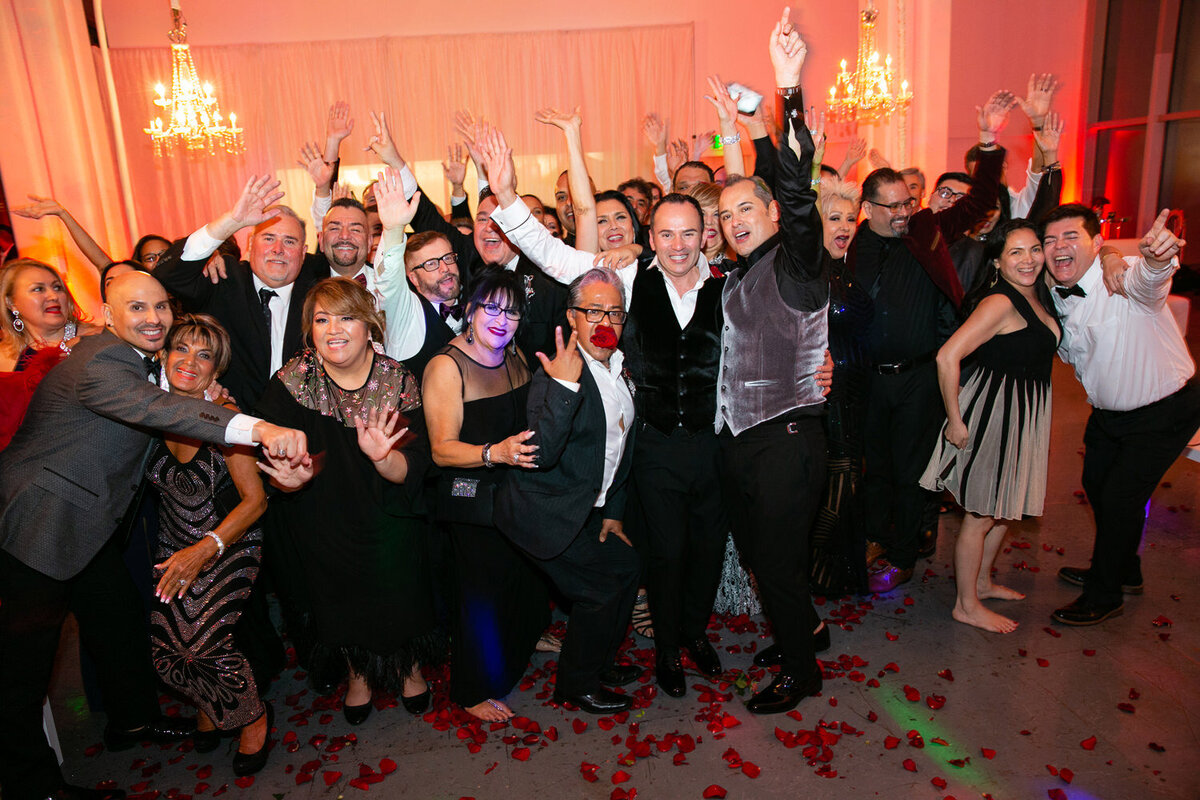 Guests celebrating on a wedding reception dance floor