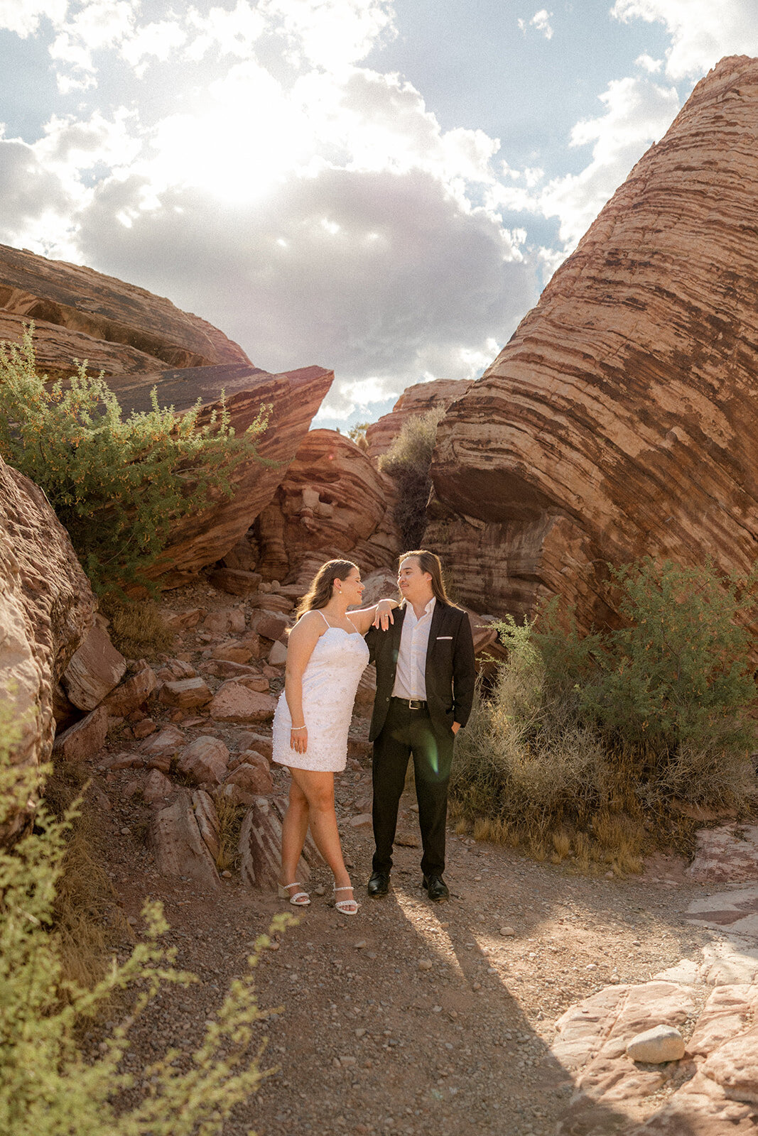 Engagement shoot at the Red Rock Canyon couple smiling at each other