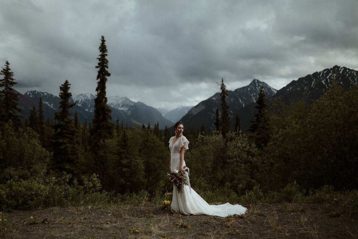 Bride standing in front of mountains