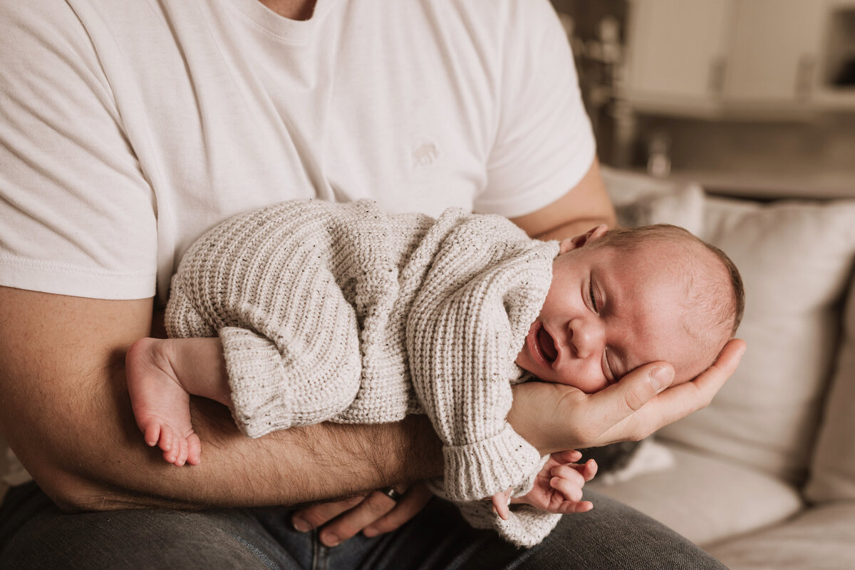 Dad holding baby