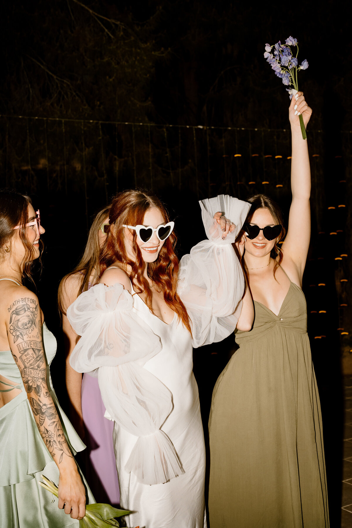 Bride and bridesmaids dancing