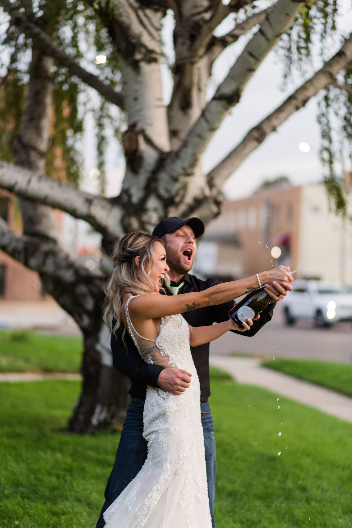 champagne spray downtown kansas wedding photographer-10