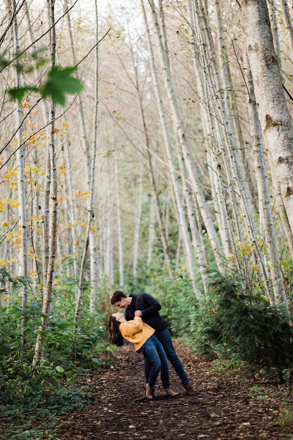 Birch trees make the mood romantic and intimate at best spot for engagement photos in Seattle, forests of Discovery Park