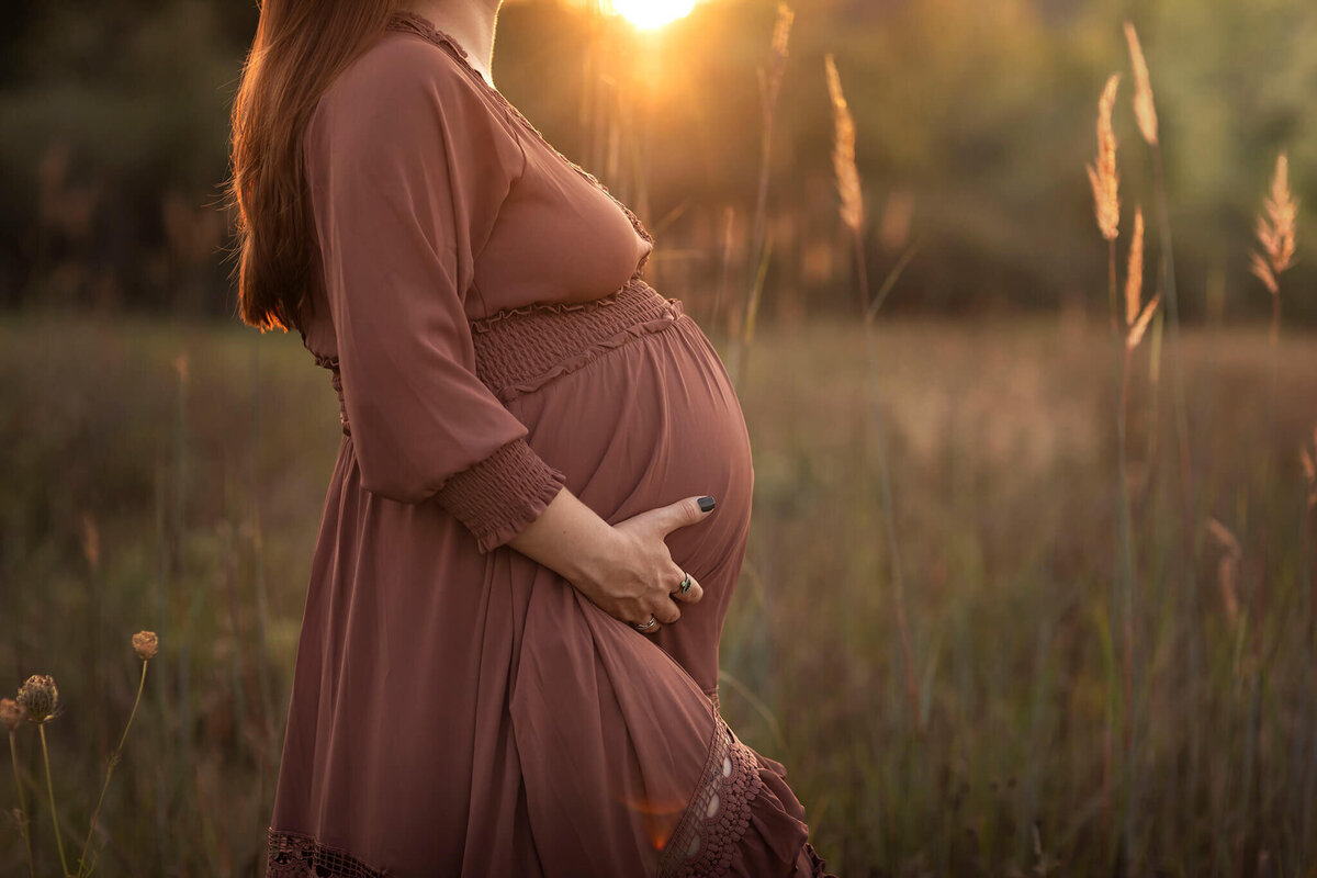 NJ Maternity photos of mom holding her belly