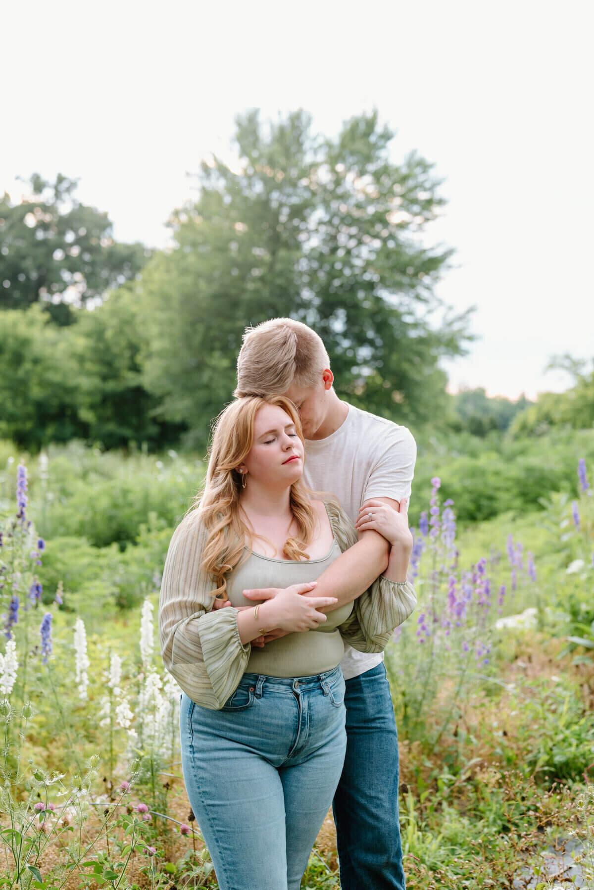 couple embracing with eyes close taken by engagement photographers nashville