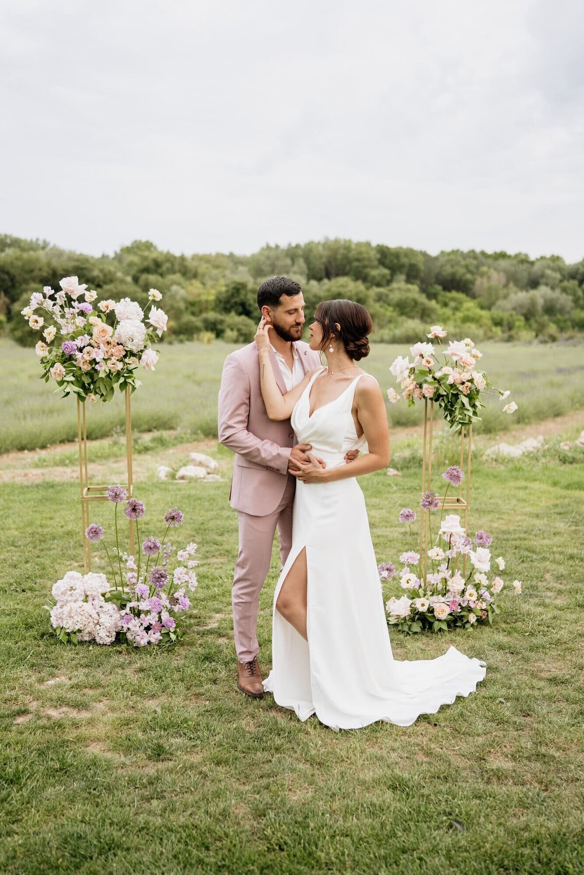 lavender-wedding-dress-with-tall-floral-displays