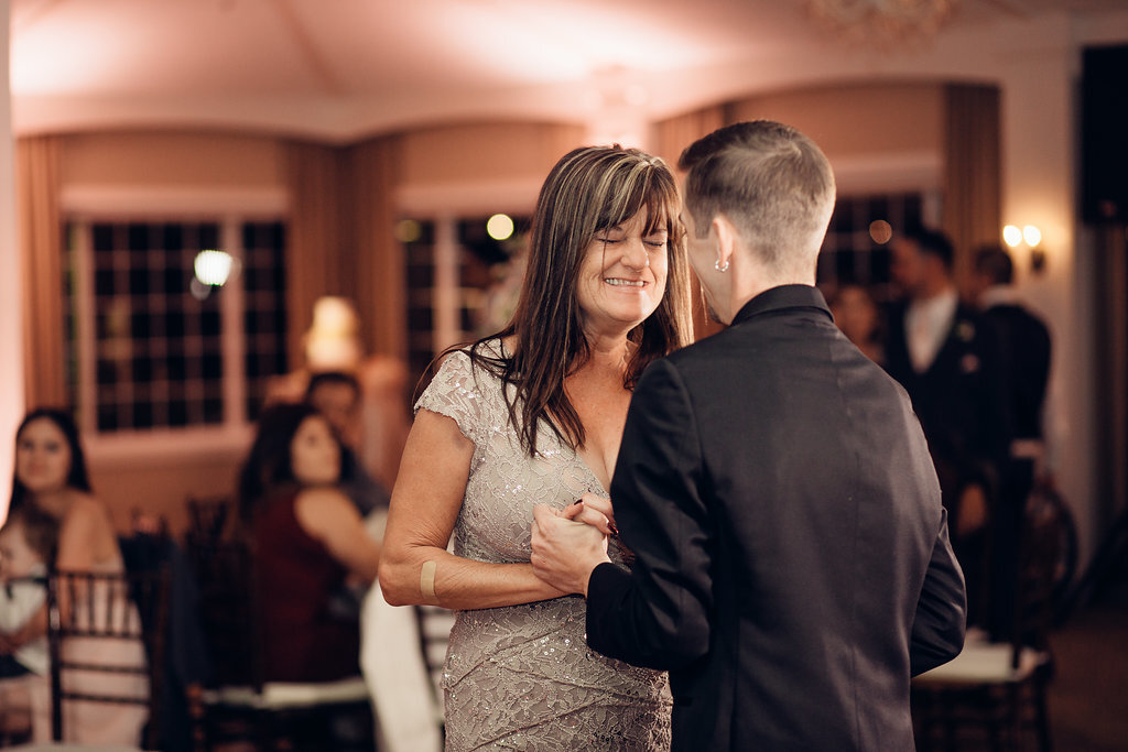 Wedding Photograph Of Woman In Light Brown Dress Smiling At The Groom Los Angeles