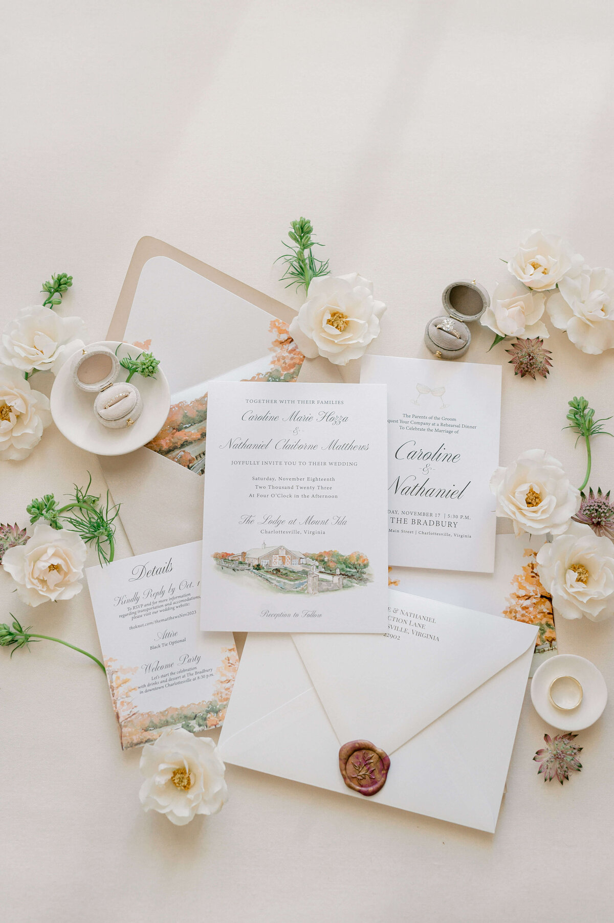 Flatlay of wedding invitations, captured by Rachael Mattio Photography