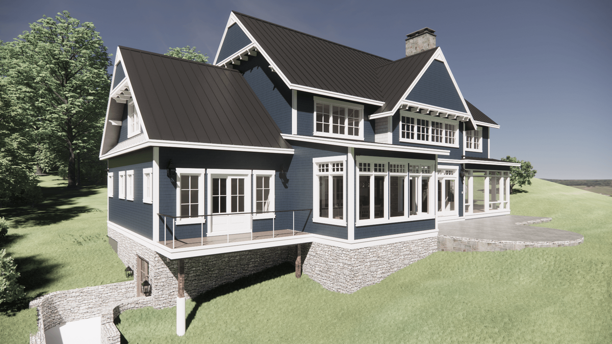 A modern two-story house with blue siding, white trim, and a black roof. It features large windows, a patio, and sits on a grassy hill. A chimney and stone foundation are visible. Trees and a clear sky are in the background.