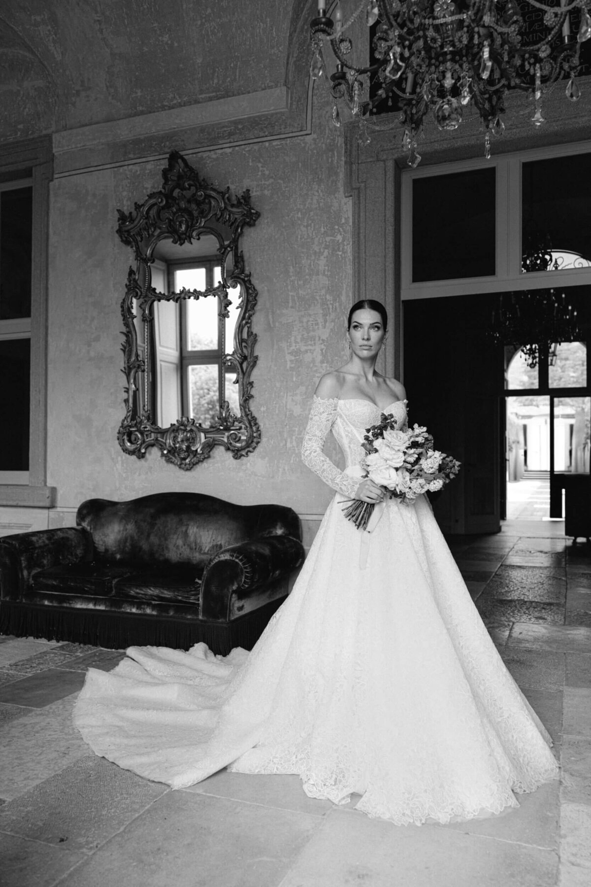 A black and white wedding photo of a bride in her white wedding dress at villa balbiano on lake como