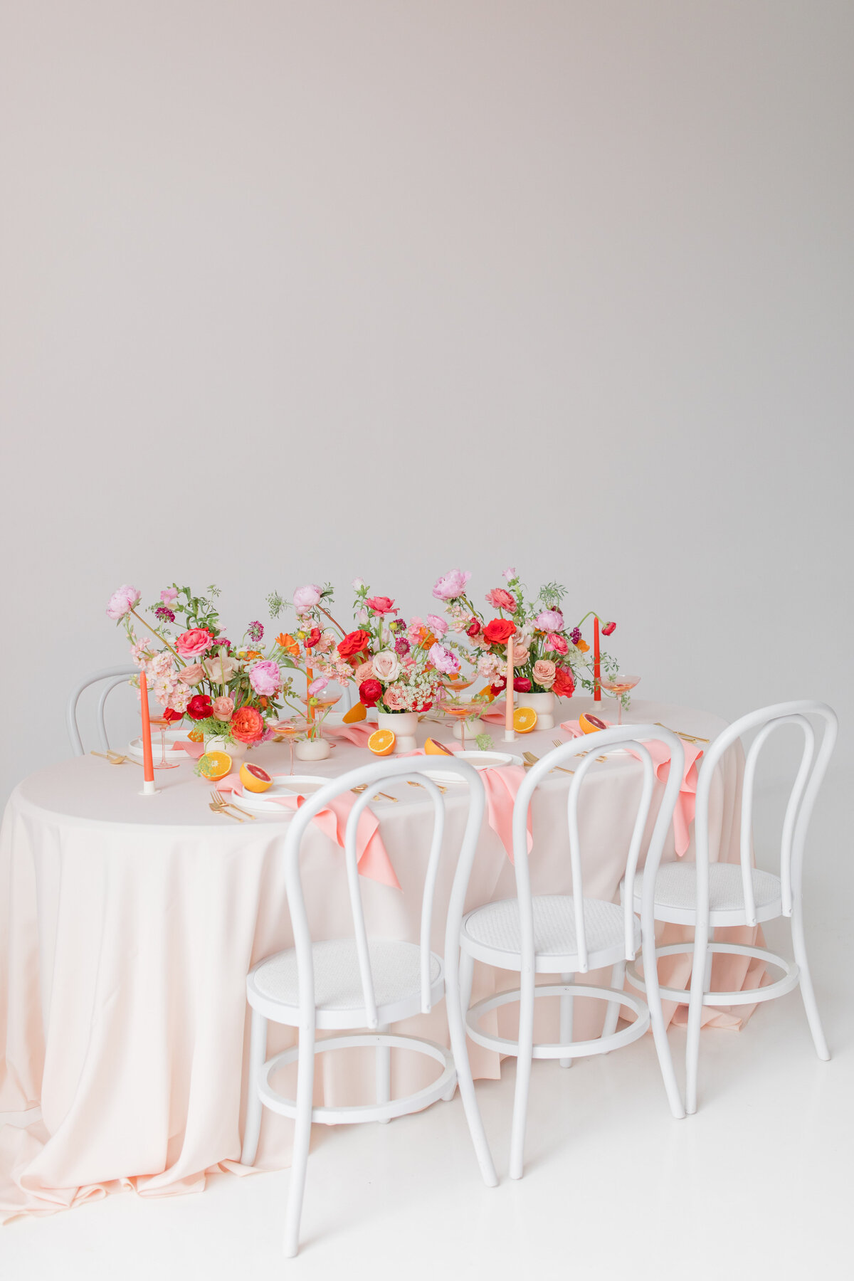 wedding table set with brightly colored florals