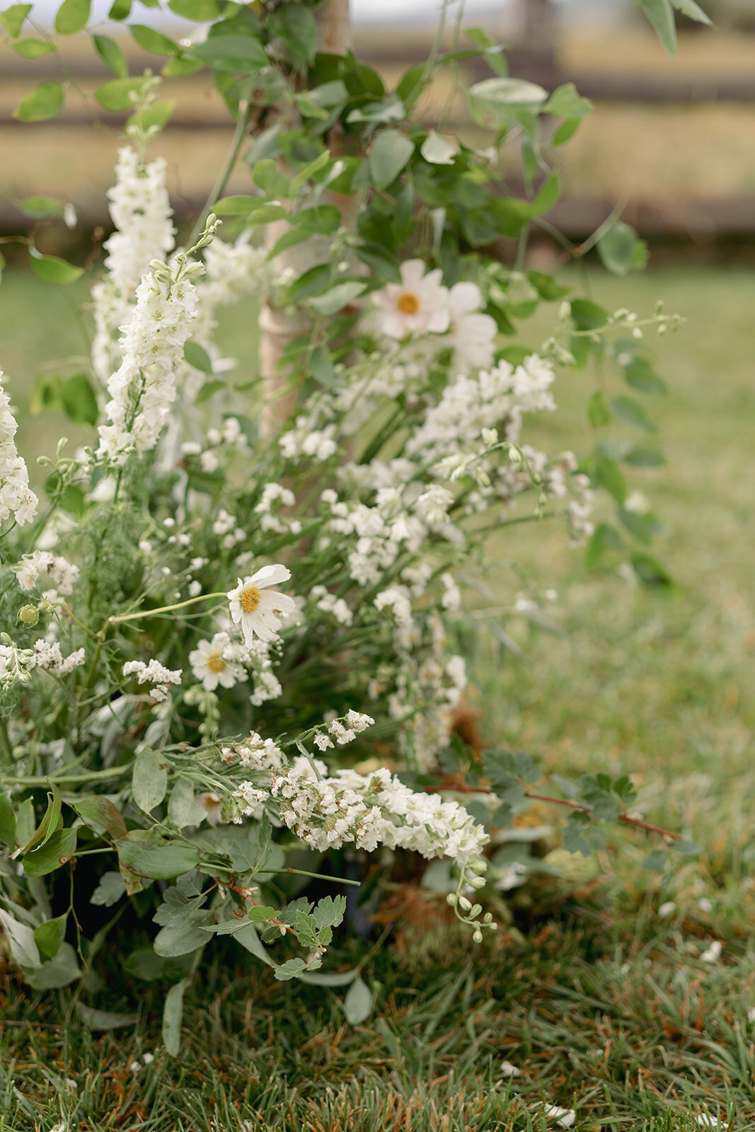 White-ground-flowers-wedding-arbor-tetons