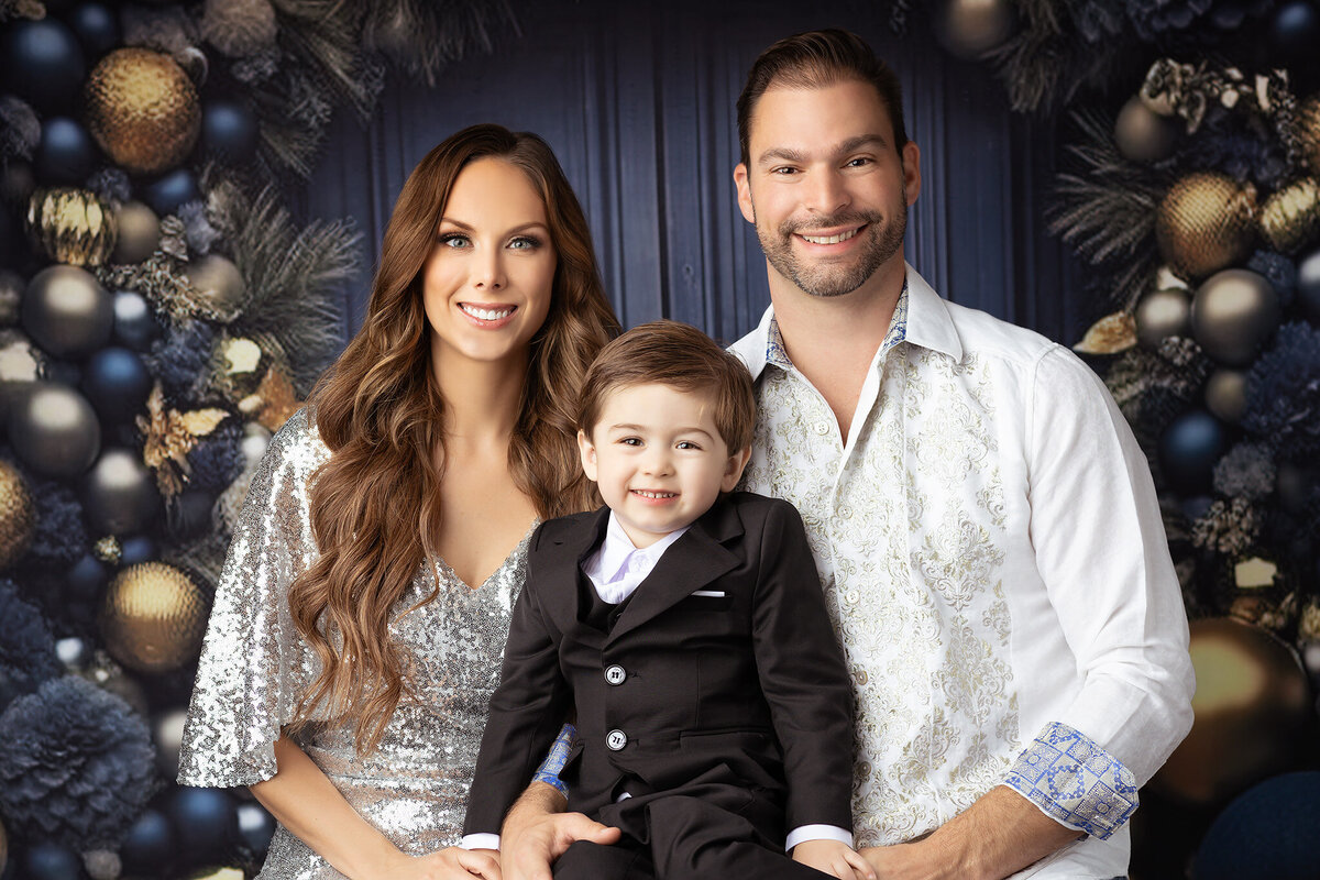 Family portrait in Dallas captured by a Dallas family photographer, showcasing holiday elegance and joy.