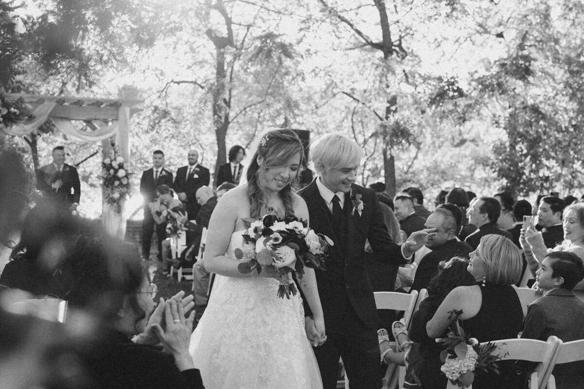 Bride and groom walking down the aisle