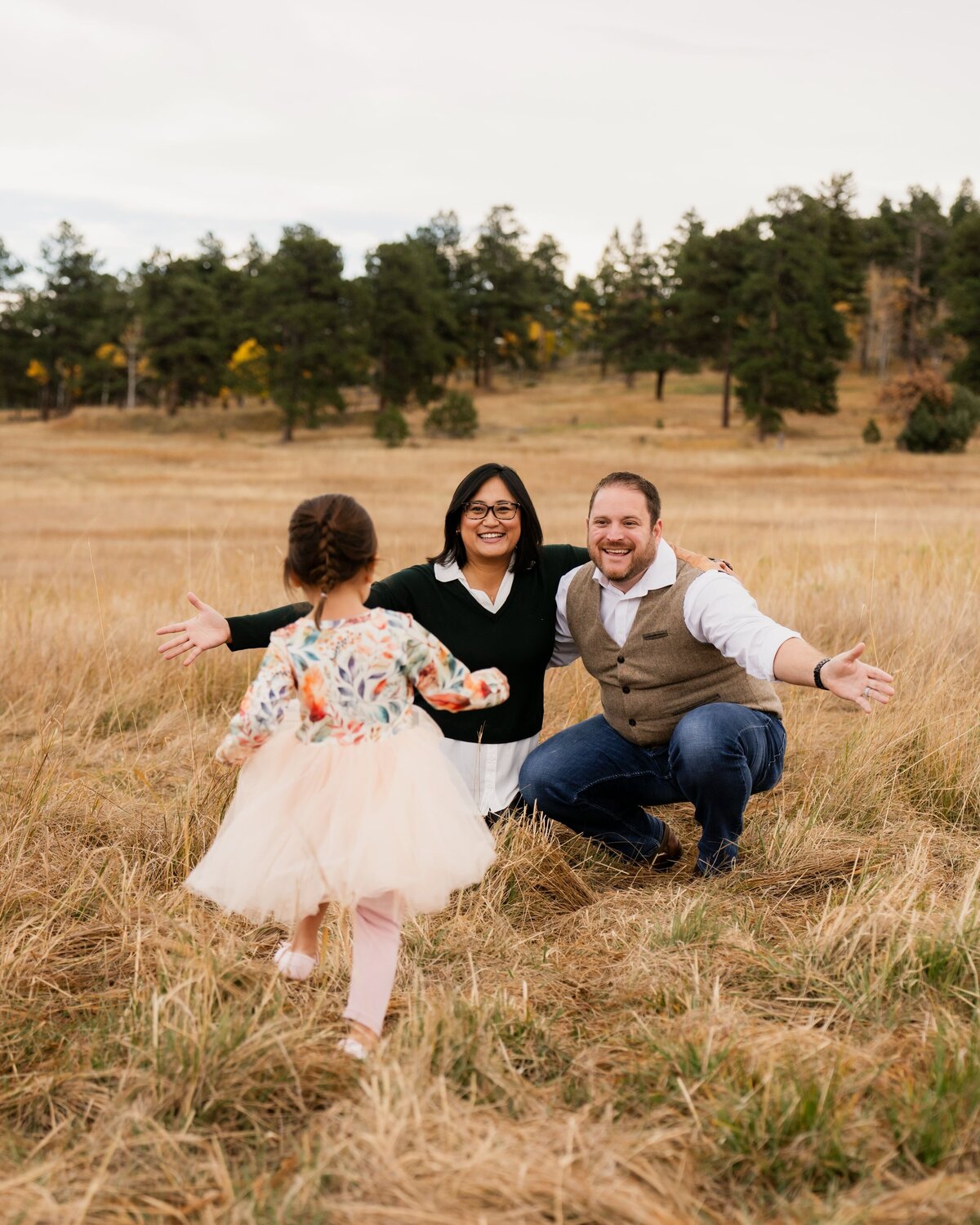 denver family photographer - little girl running to parents