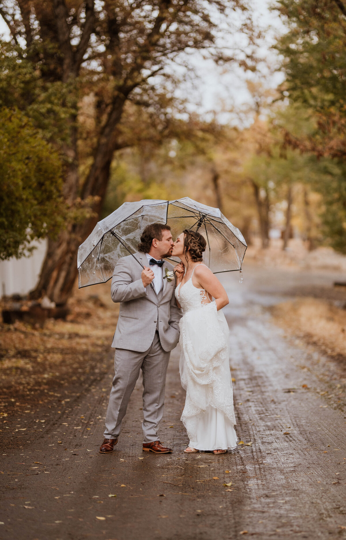 A couple kissing in the rain under an umbrella in Genoa