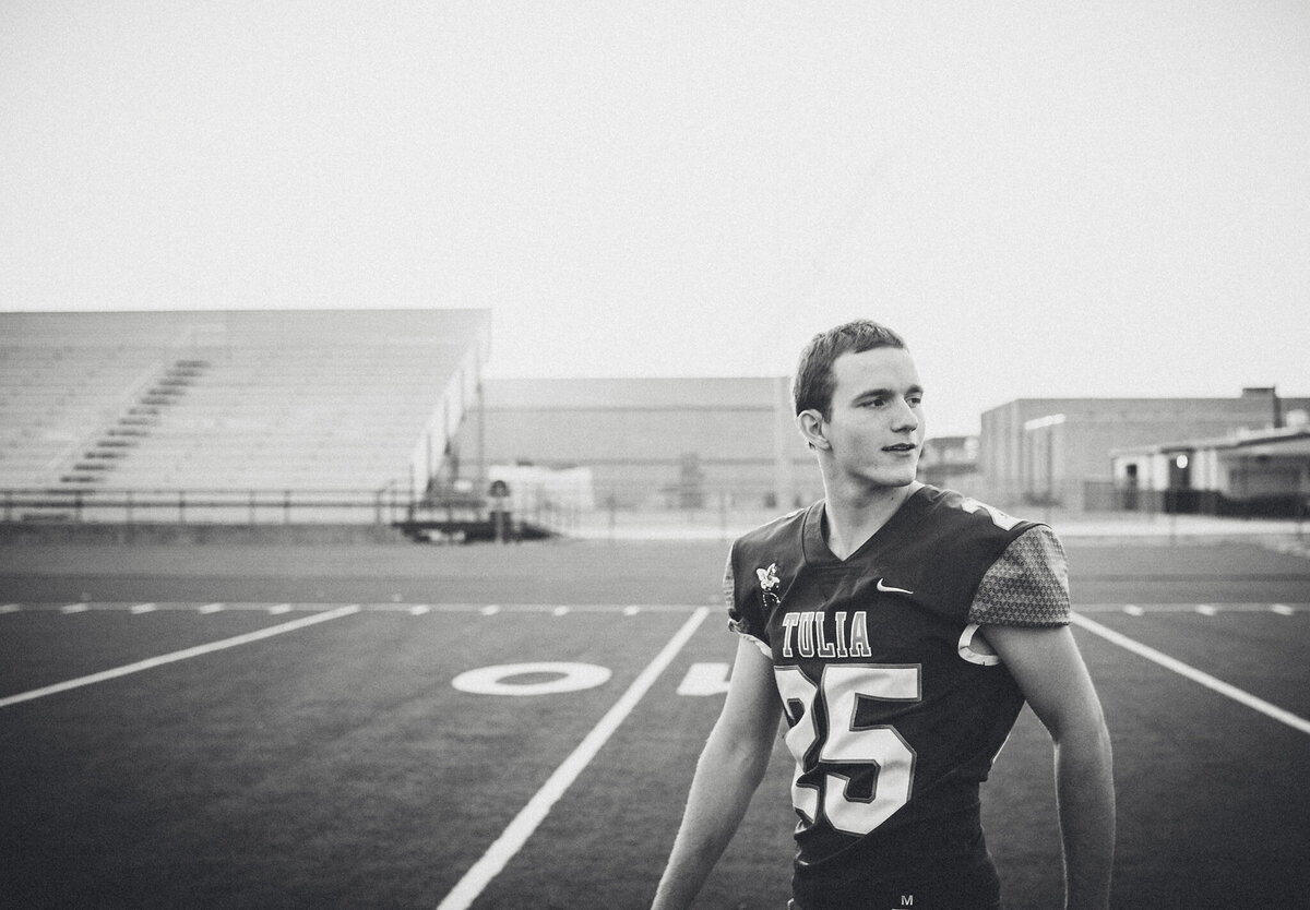 Boy senior playing football