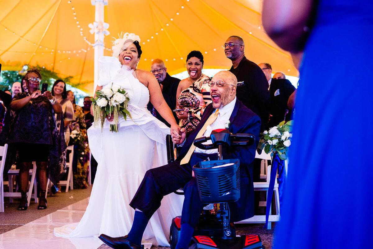 One of the top wedding photos of 2021. Taken by Adore Wedding Photography- Toledo, Ohio Wedding Photographers. This photo is of a bride and her handicap father at the beginning of a wedding ceremony