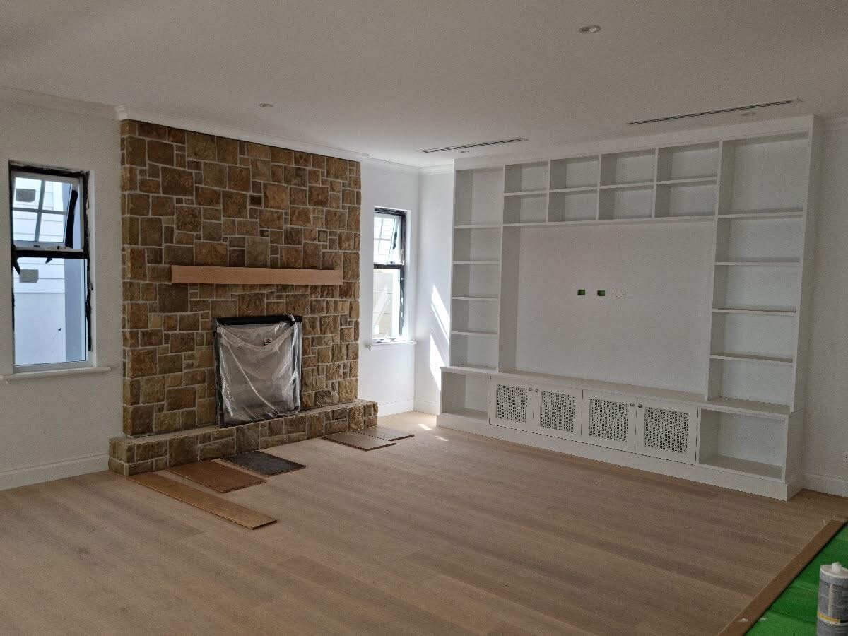 Hamptons-inspired interior with crisp white walls and soft neutral tones, professionally painted by New-Style Painting Service.
