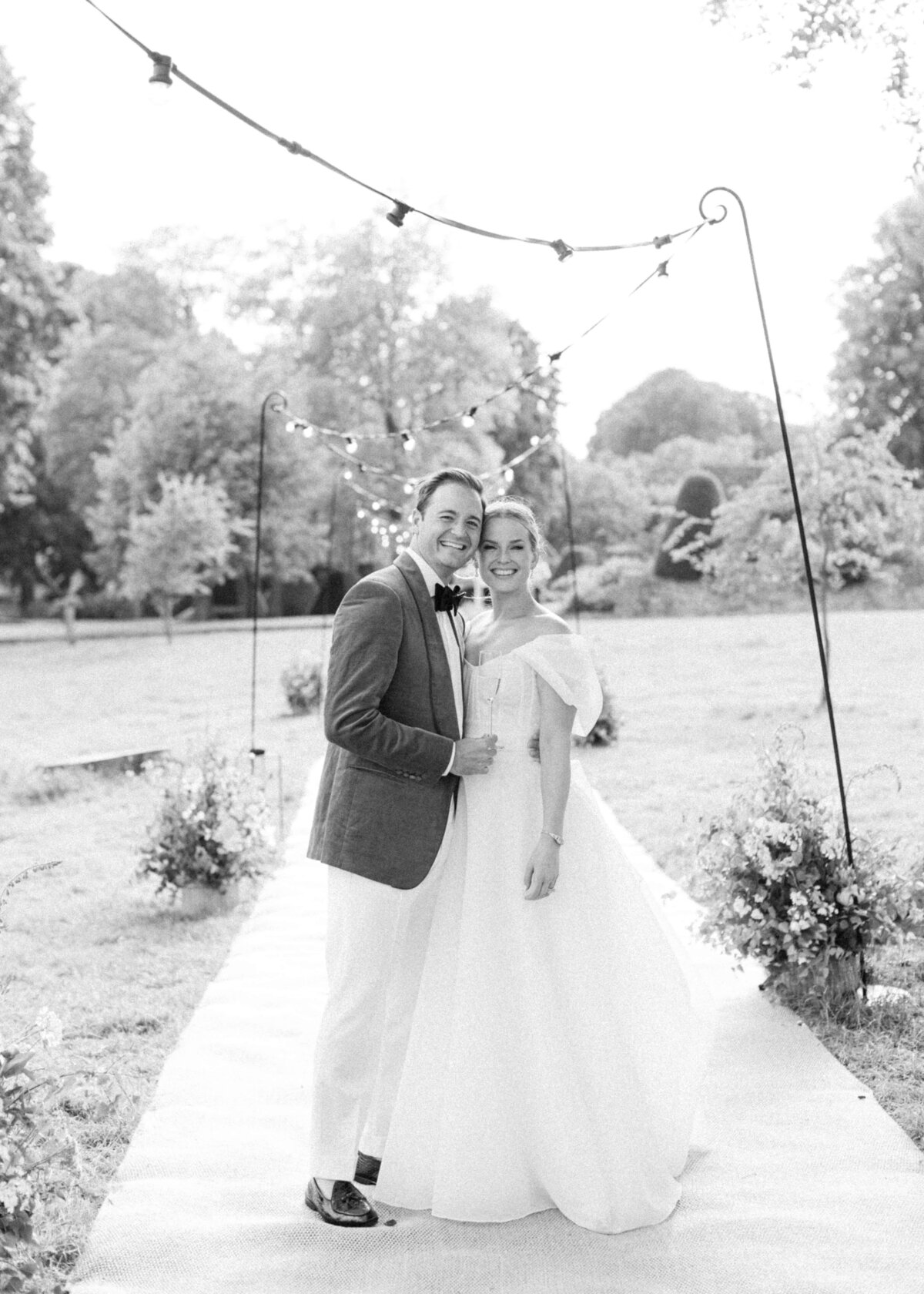 chloe-winstanley-weddings-cotswolds-cornwell-manor-monique-lhuillier-bride-groom-tent-black-white