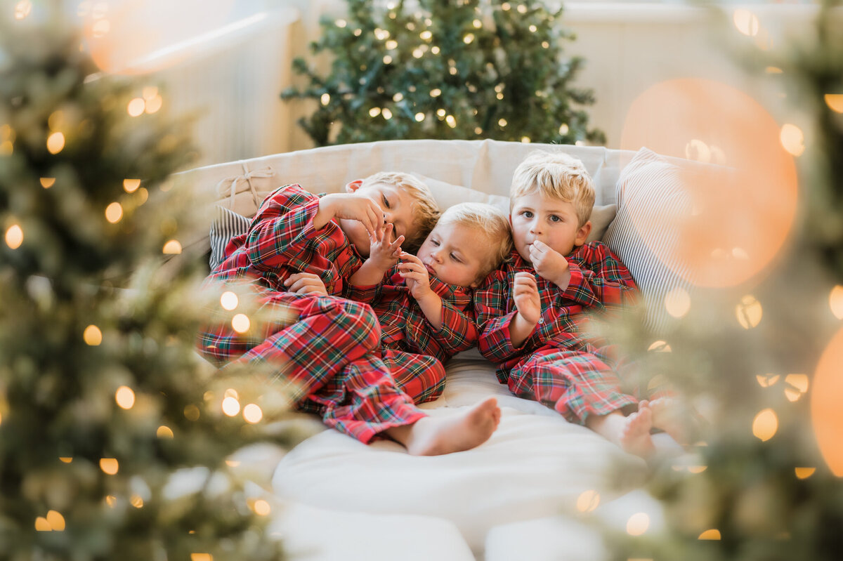 A big family interacts playfully inside their home. Candid and playful family photography by Cassey Golden.