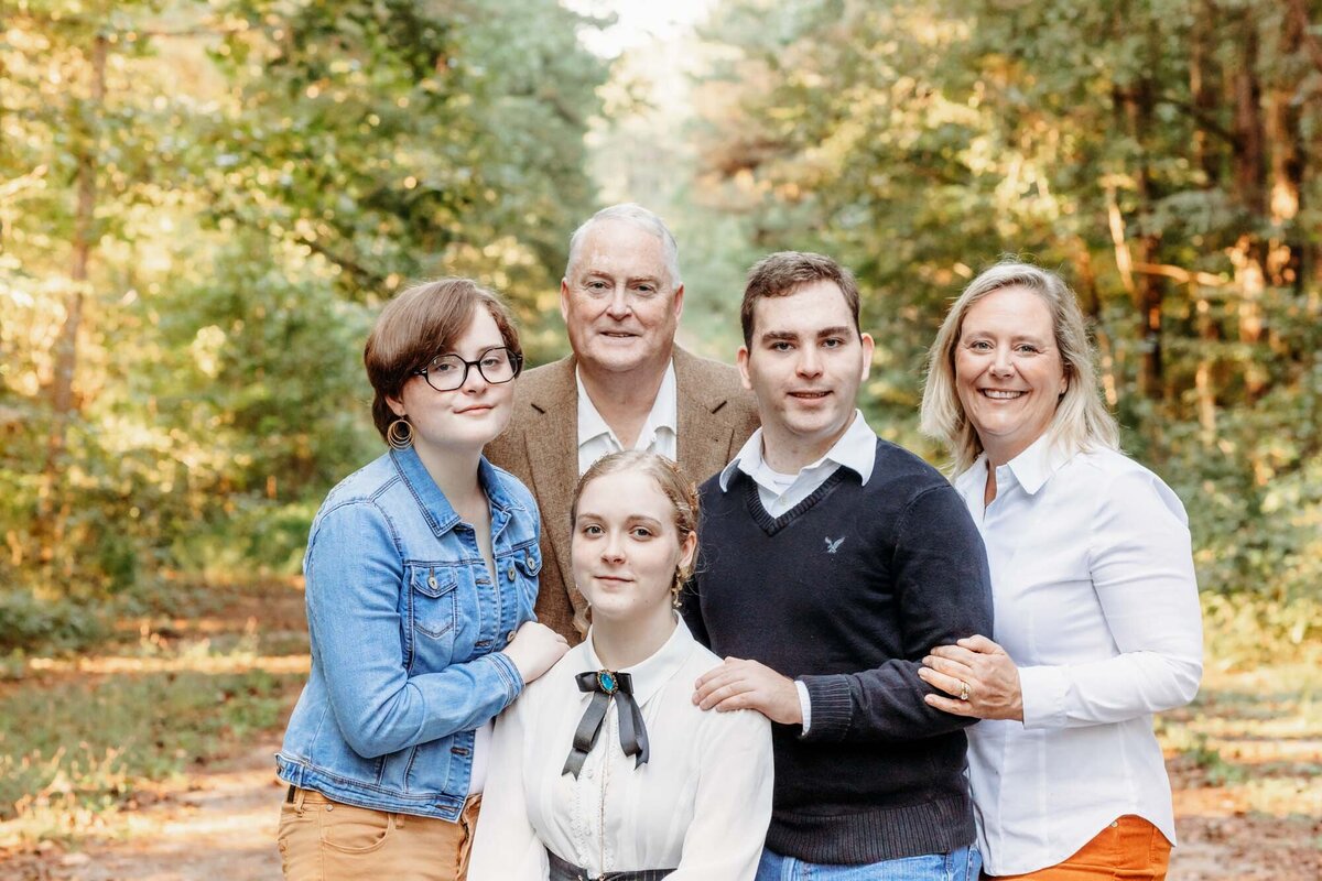 A fall family portrait with yellows and oranges.