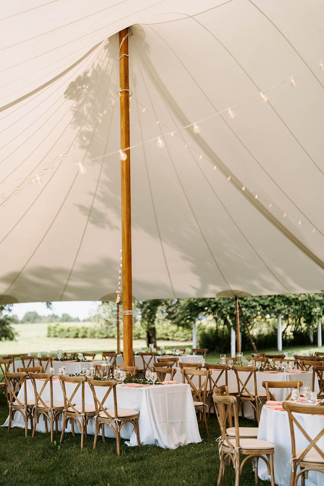 tented wedding reception with white and blush decor in upstate new york