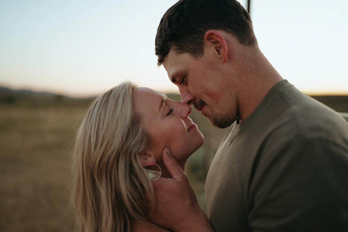 Couple during golden hour engagement shoot in Idaho wedding/elopement - photographed by The Storytellers