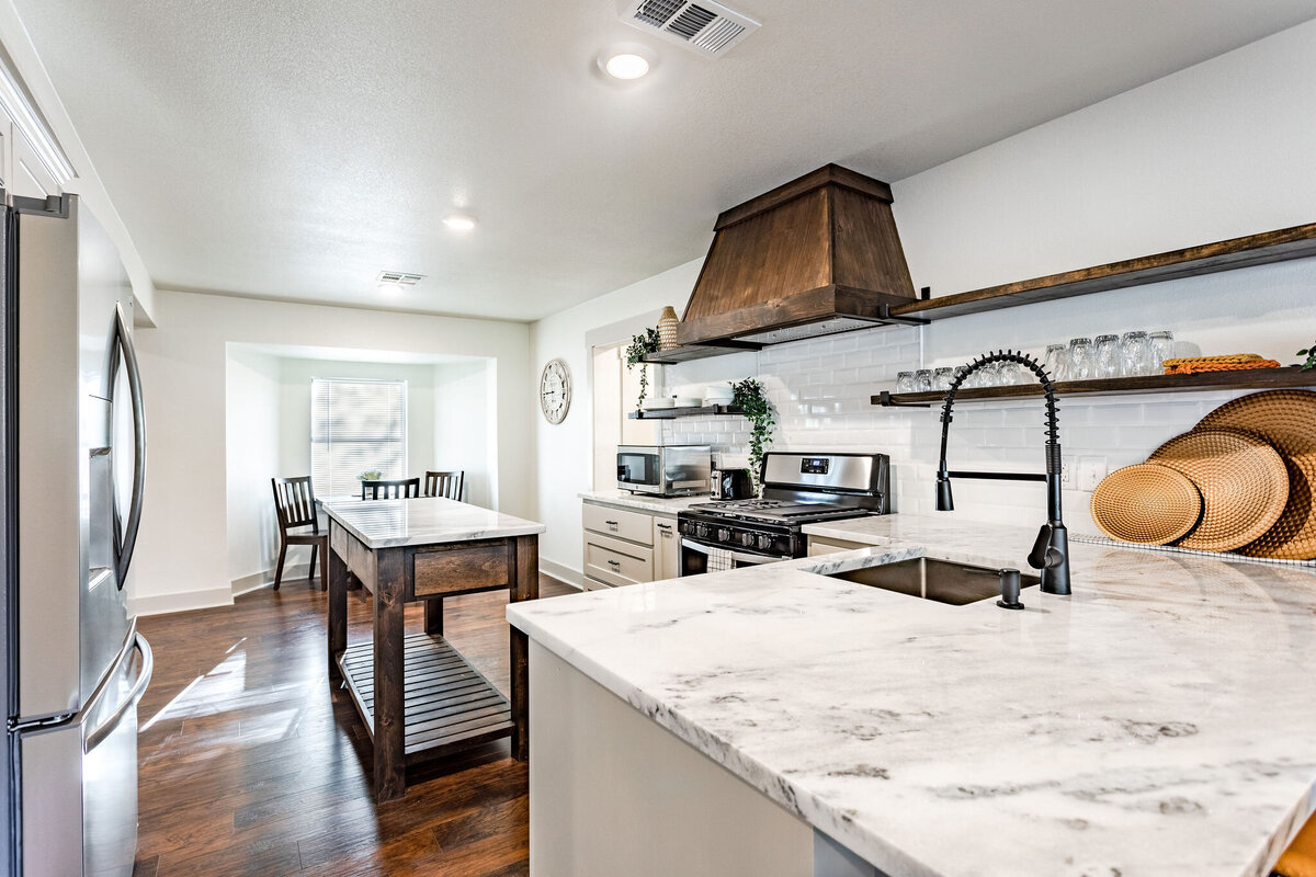 Beautiful kitchen with generous counter space in this 4-bedroom, 3.5 bathroom country house for 12 just 10 minutes from downtown Waco, TX.
