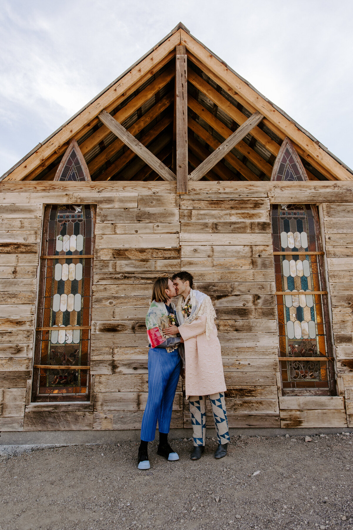 Two people lean in for a kiss at a Nelson's Ghost Town wedding.