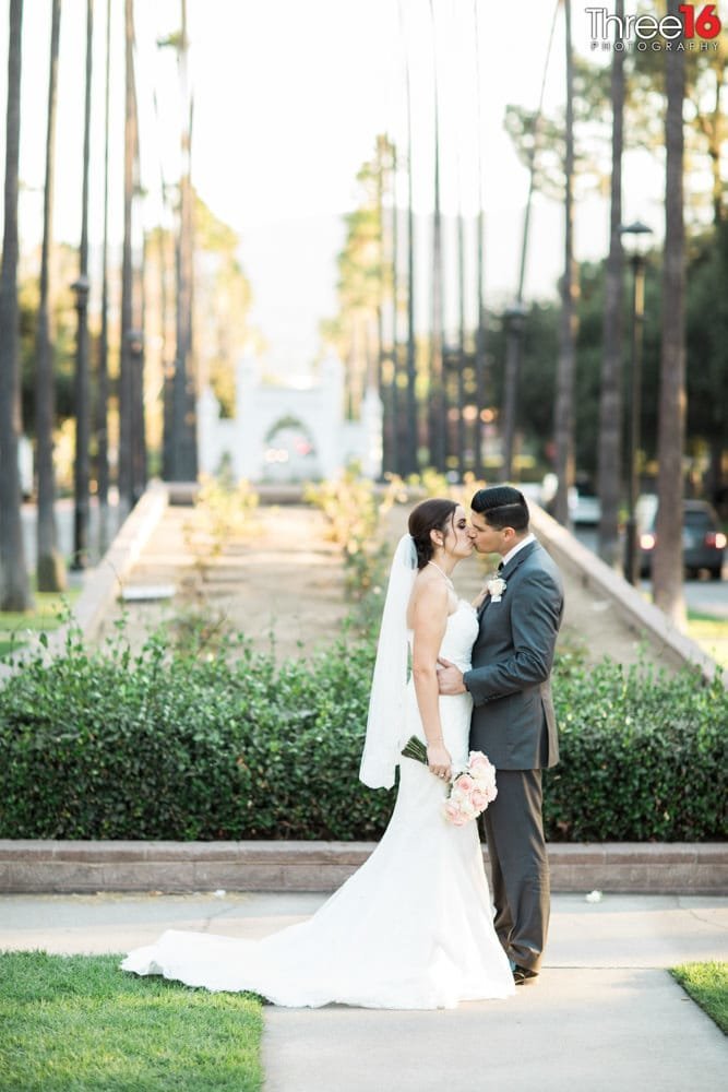 Bride and Groom share an intimate kiss