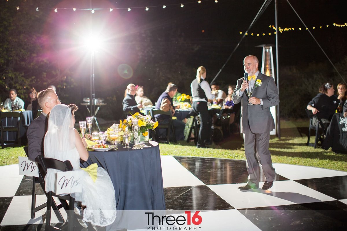 Father toasting the newly married couple