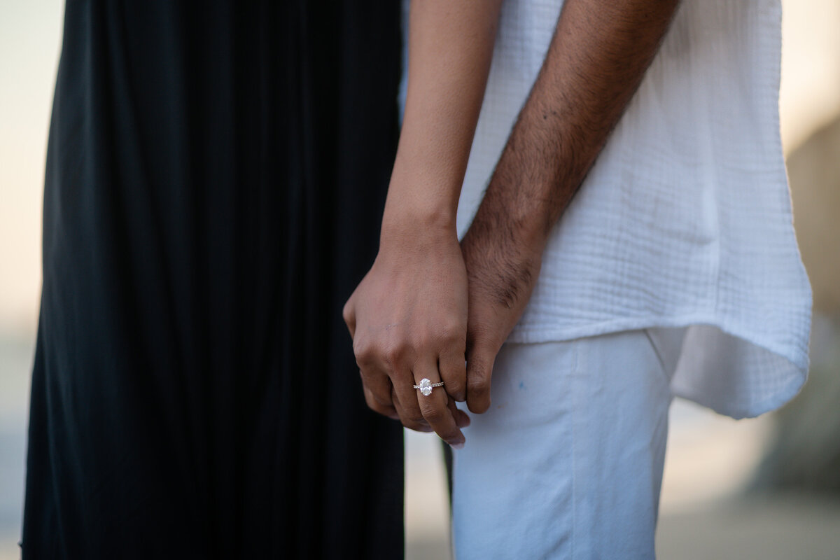 Indian couple eloping at El Matador State Beach in Malibu during sunset with hand ring shot.