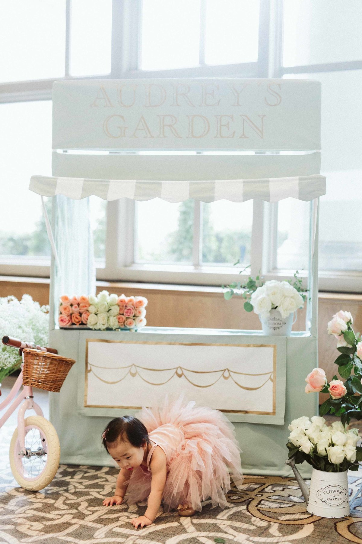 baby in pink tutu dress  in front of flower shop handmade at Fairmont Olympic