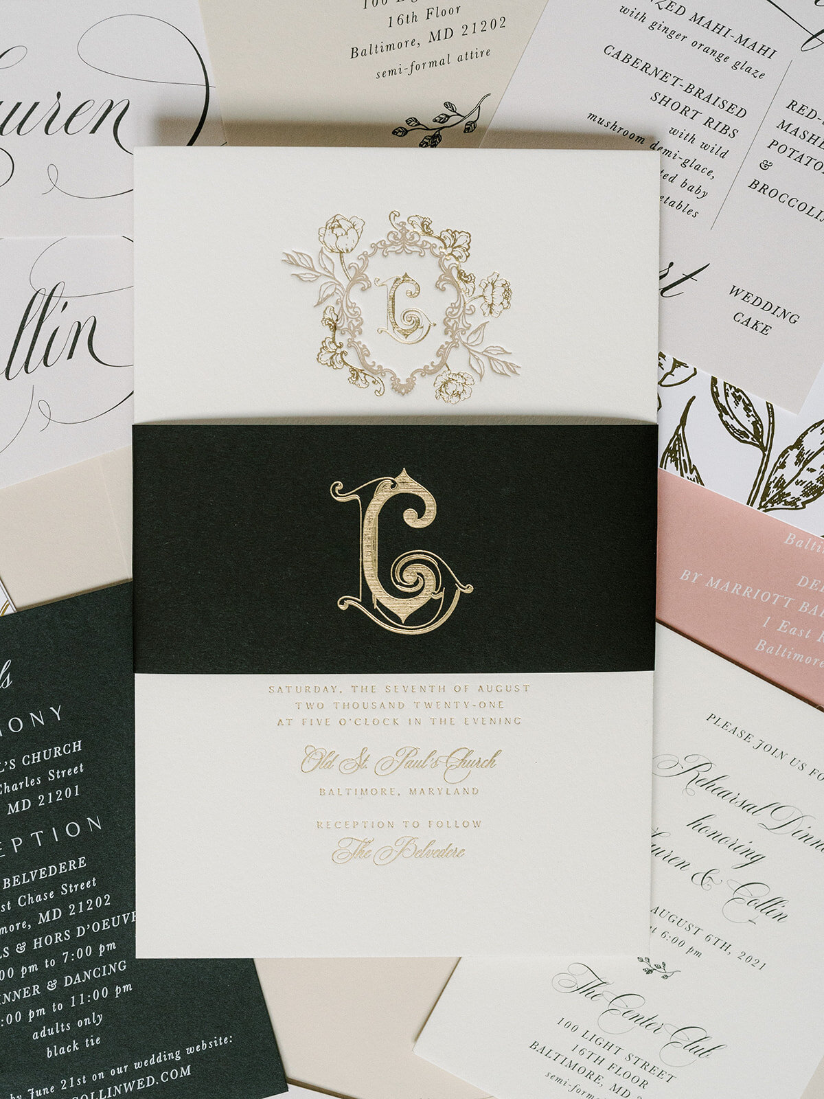opulent letterpress wedding invitation with floral monogram and black belly band by emily baird