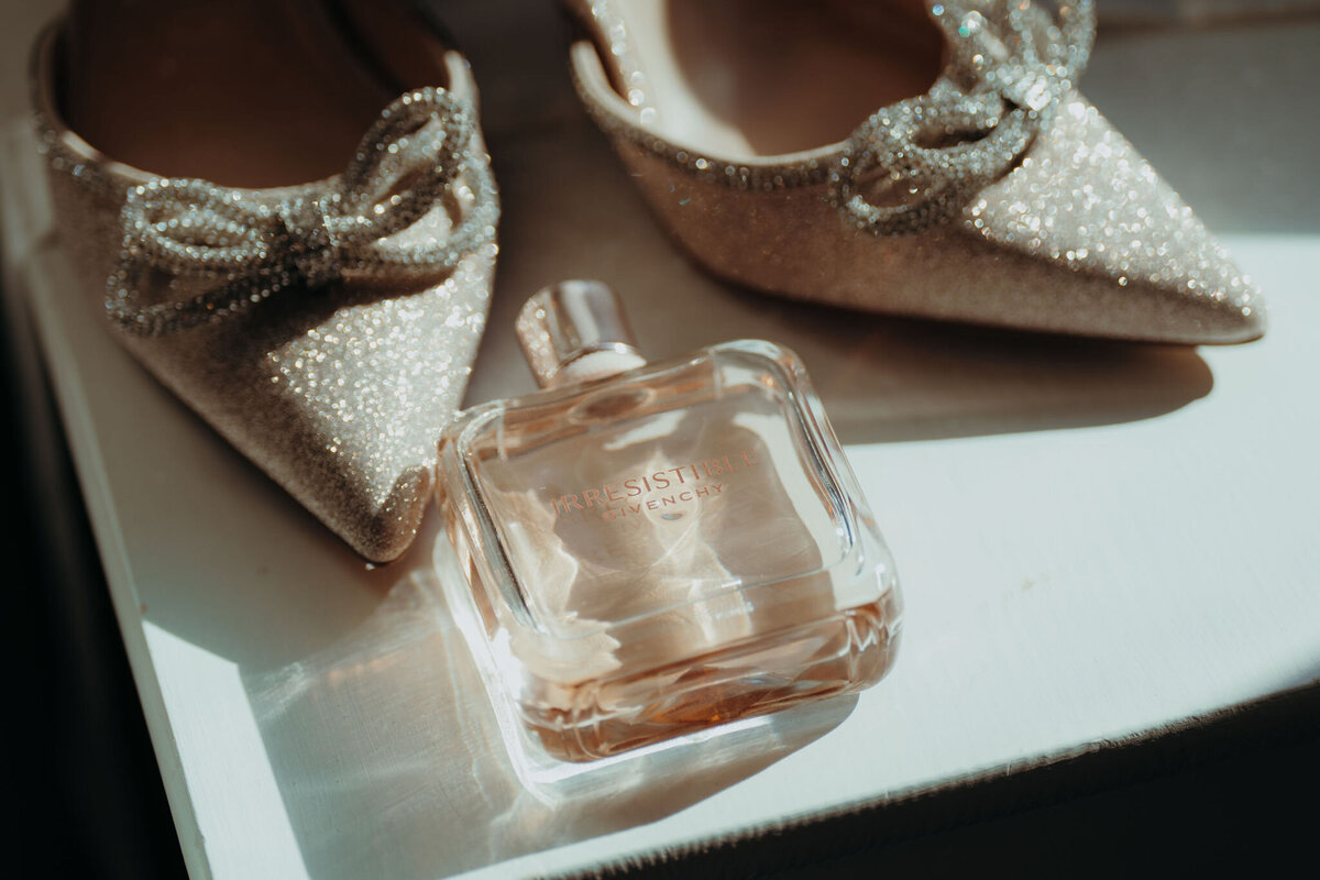 bridal shoes and a perfume bottle