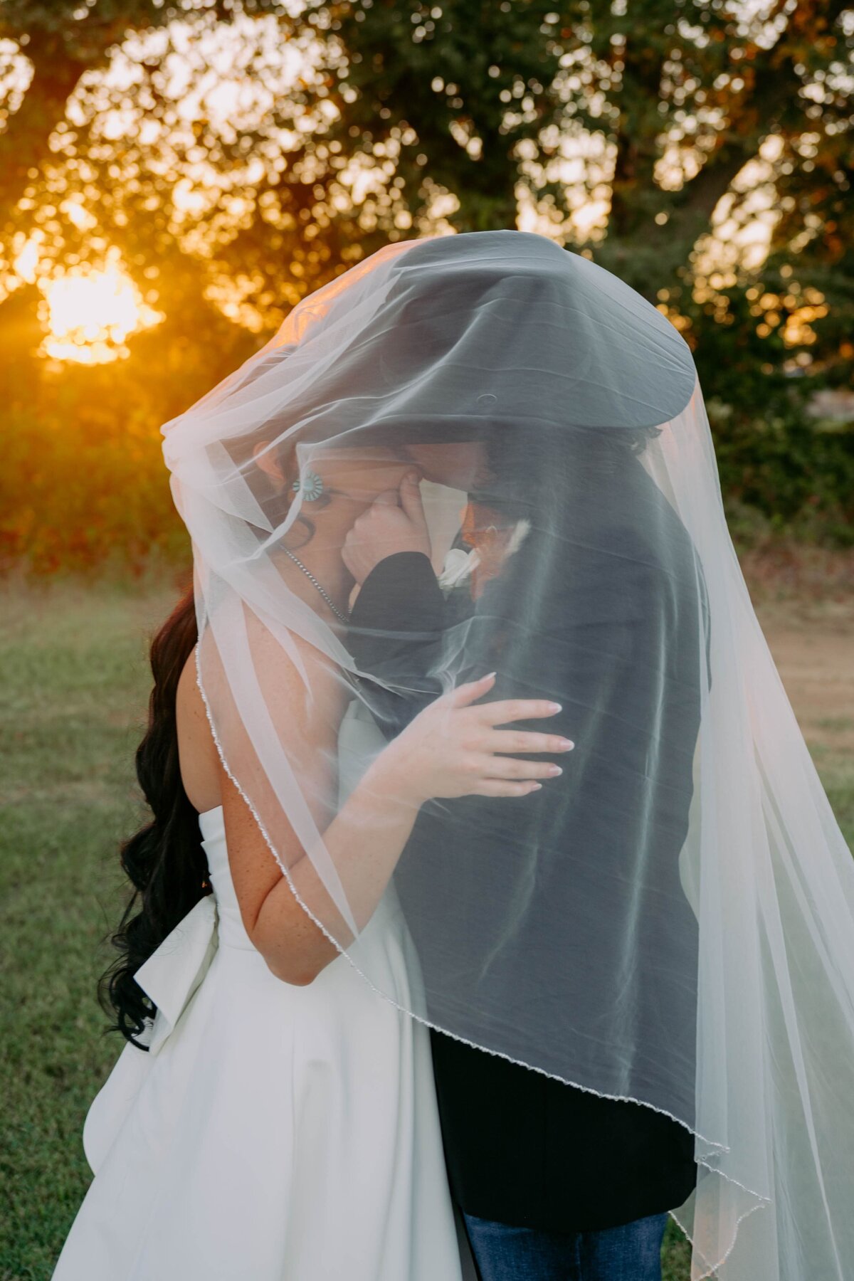 sunset-image-bride-groom-under-veil