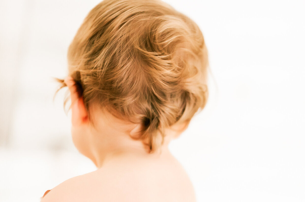 close up of curls in hair of baby boy
