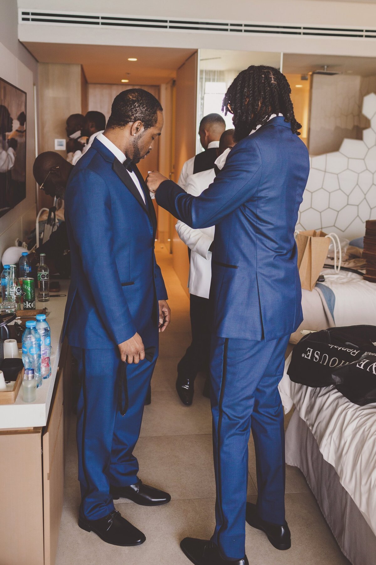 Groomsmen getting ready for wedding in Cancun